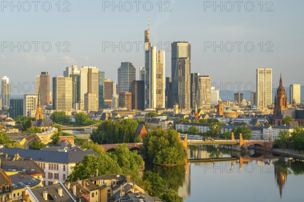 Frankfurt City Skyline, Residential Buildings, Bridges and Main River on Sunny Morning. Aerial View. Golden Hour. Hesse, Germany