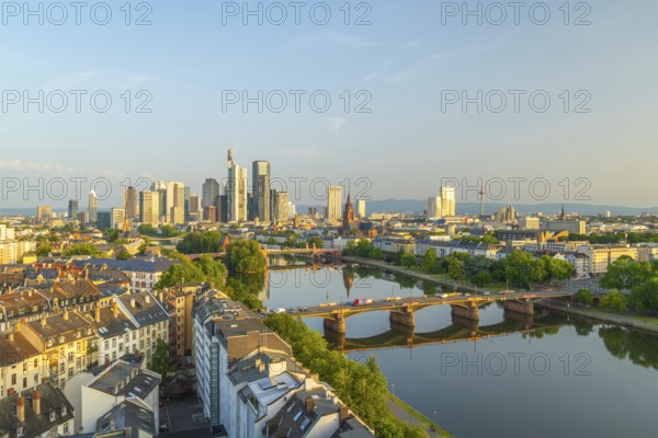 Frankfurt City Skyline, Residential Buildings, Bridges and Main River on Sunny Morning. Wide Shot. Aerial View. Golden Hour. Hesse, Germany