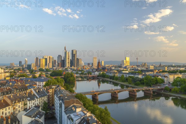 Frankfurt City Downtown, Residential Buildings, Bridges and Main River at Sunrise. Wide Shot. Aerial View. Golden Hour. Hesse, Germany