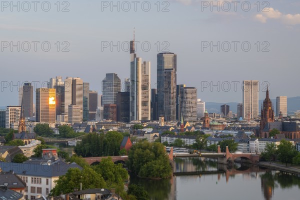 Frankfurt City Skyline, Residential Buildings, Bridges and Main River at Sunrise. Aerial View. Golden Hour. Hesse, Germany