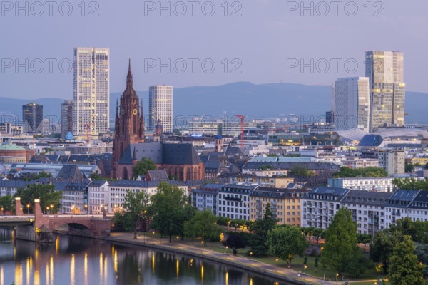 Frankfurt Cathedral, Residential Buildings, Illuminated City and Main River at Morning Twilight. Aerial View. Blue Hour. Hesse, Germany