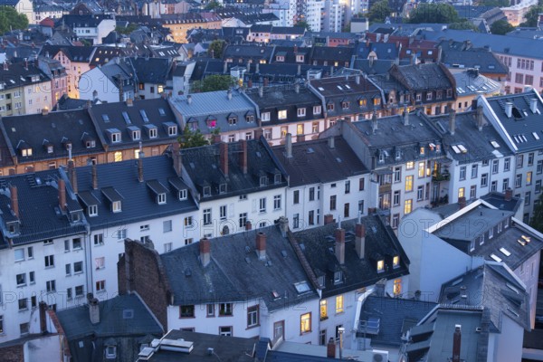 Old Residential Buildings in Frankfurt City at Evening Twilight with Illuminated Windows. Aerial View. Hesse, Germany