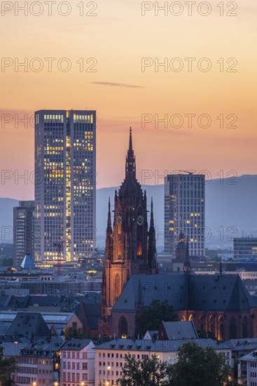 Illuminated Frankfurt Cathedral, Residential Buildings and City at Evening Twilight. Aerial View. Blue Hour. Hesse, Germany