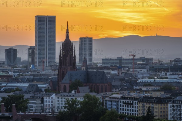 Frankfurt Cathedral, Residential Buildings and City at Fiery Sunset. Aerial View. Golden Hour. Hesse, Germany
