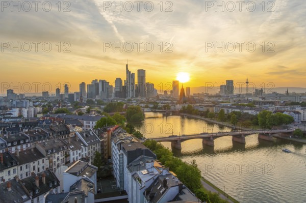 Frankfurt City Downtown, Residential Buildings, Bridges and Main River at Sunset. Wide Shot. Aerial View. Golden Hour. Hesse, Germany
