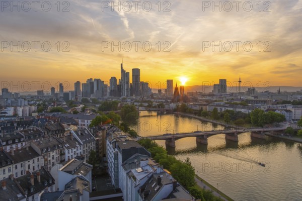 Frankfurt Downtown Skyline, Residential Buildings, Bridges and Main River at Fiery Sunset. Wide Shot. Aerial View. Golden Hour. Hesse, Germany