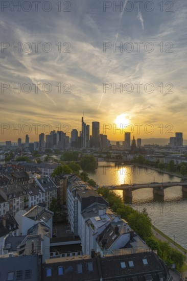 Frankfurt City Skyline, Residential Buildings, Bridges and Main River at Sunset. Wide Shot. Aerial View. Golden Hour. Hesse, Germany