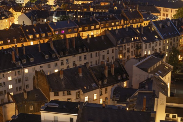 Old Residential Buildings in Frankfurt City at Night with Lights in Windows. Aerial View. Hesse, Germany