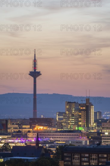 FRANKFURT, GERMANY, JUNE 12, 2025: Illuminated Europaturm Telecommunications Tower in Frankfurt City at Night. Blue Hour. Hesse, Germany