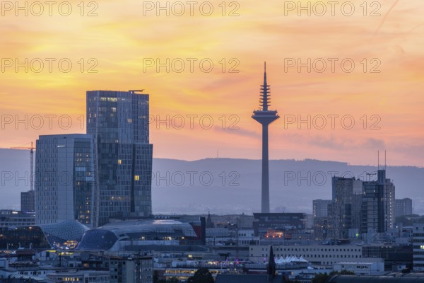FRANKFURT, GERMANY, JUNE 12, 2025: Europaturm Telecommunications Tower in Frankfurt City at Fiery Sunset. Hesse, Germany