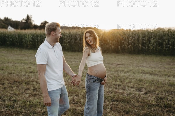 Pregnant, young woman with partner