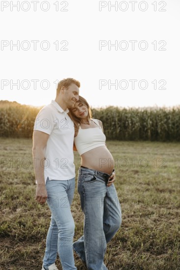 Pregnant, young woman with partner