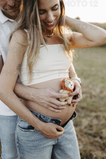 Pregnant, young woman with partner