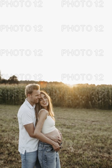 Pregnant, young woman with partner