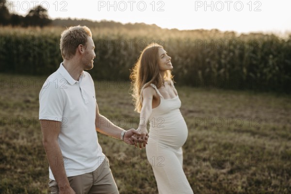Pregnant, young woman with partner