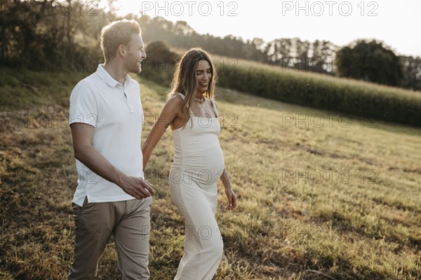 Pregnant, young woman with partner