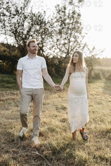 Pregnant, young woman with partner