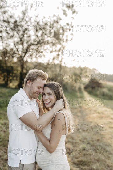 Pregnant, young woman with partner