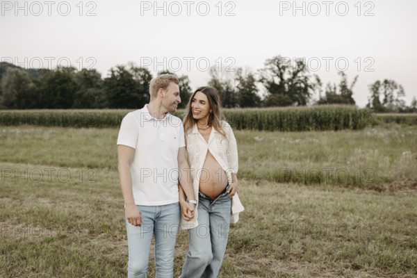 Pregnant, young woman with partner