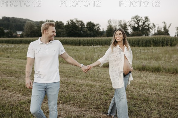 Pregnant, young woman with partner