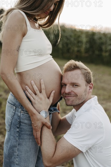Pregnant, young woman with partner