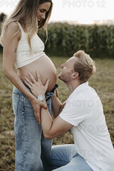 Pregnant, young woman with partner