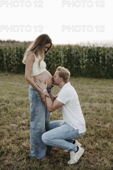 Pregnant, young woman with partner
