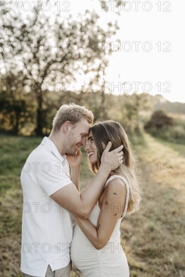 Pregnant, young woman with partner