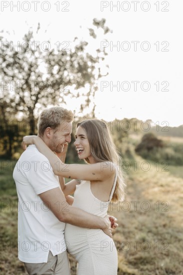 Pregnant, young woman with partner