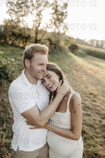 Pregnant, young woman with partner