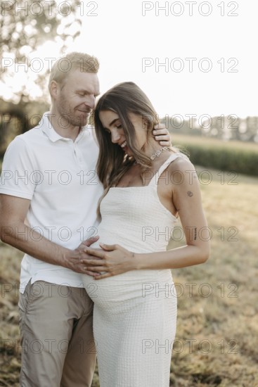 Pregnant, young woman with partner