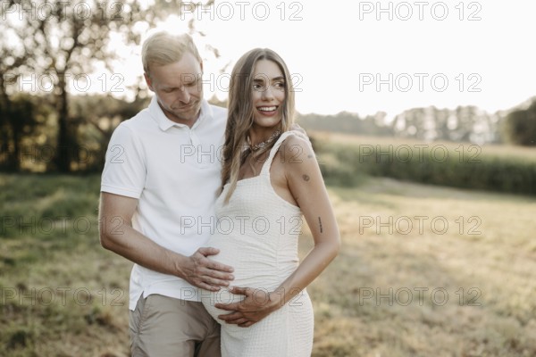 Pregnant, young woman with partner