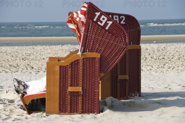 Pure enjoyment of the last rays of sunshine of the year on the beach of Norddorf on the North Frisian island of Amrum, Amrum, Norddorf, North Frisia, Germany