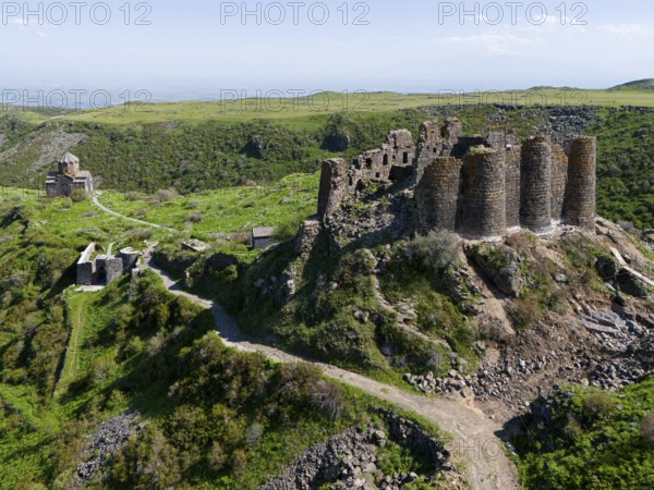 Historic castle ruins on green hills surrounded by nature, aerial view, Amberd Fortress and Mother of God Church, Vahramashen Church, Vahramashen Surp Astvatsatsin, Amberd Church, Aragazotn Province, Armenia