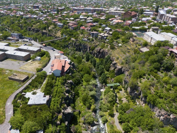 Urban view with a river surrounded by houses and a rocky gorge, aerial view, Kassagh River, Ashtarak, Ashtarak, Aštarak, Aragazotn Province, Armenia