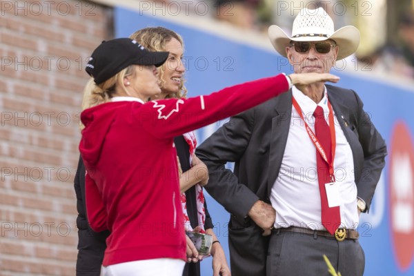 Tiffany Foster, Amy Millar and Chef d'Equipe, Ian Millar from Team Canada watch Susan Horn compete during the first round of the 2025 BMO Nations Cup during the Spruce Meadows Masters on September 6, 2025 in Calgary, Alberta, Canada, North America
