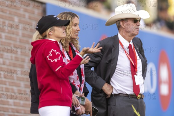 Tiffany Foster, Amy Millar and Chef d'Equipe, Ian Millar from Team Canada watch Susan Horn compete during the first round of the 2025 BMO Nations Cup during the Spruce Meadows Masters on September 6, 2025 in Calgary, Alberta, Canada, North America