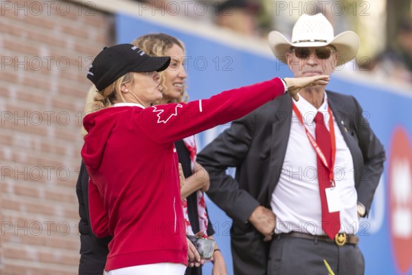 Tiffany Foster, Amy Millar and Chef d'Equipe, Ian Millar from Team Canada watch Susan Horn compete during the first round of the 2025 BMO Nations Cup during the Spruce Meadows Masters on September 6, 2025 in Calgary, Alberta, Canada, North America