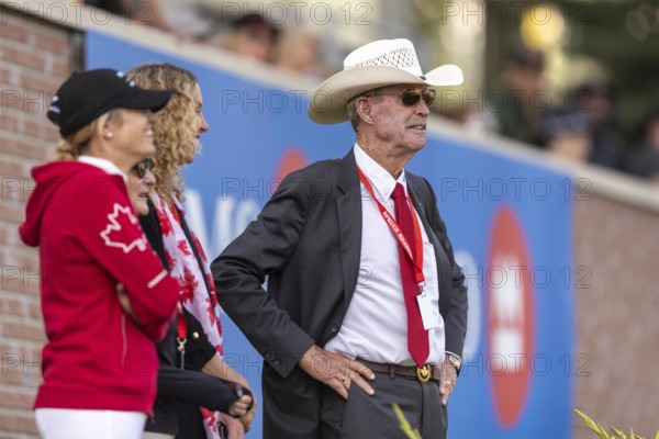 Tiffany Foster, Amy Millar and Chef d'Equipe, Ian Millar from Team Canada watch Susan Horn compete during the first round of the 2025 BMO Nations Cup during the Spruce Meadows Masters on September 6, 2025 in Calgary, Alberta, Canada, North America