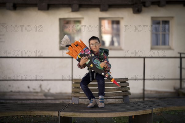 Boy, 6 years, glasses, multi-ethnic, on the day of enrolment in first grade of primary school, first grader with school bag, Blaubeuren, Baden-Württemberg, Germany