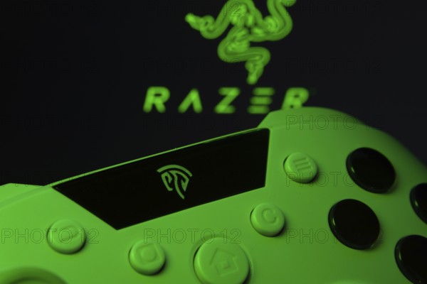 Dhaka, Bangladesh- 13 Sep 2025: A close-up of a gamepad with the Razer seen on screen in the background