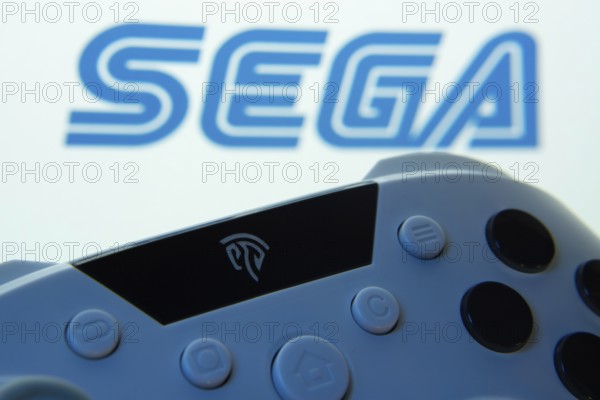 Dhaka, Bangladesh- 13 Sep 2025: A close-up of a gamepad with the Sega seen on screen in the background