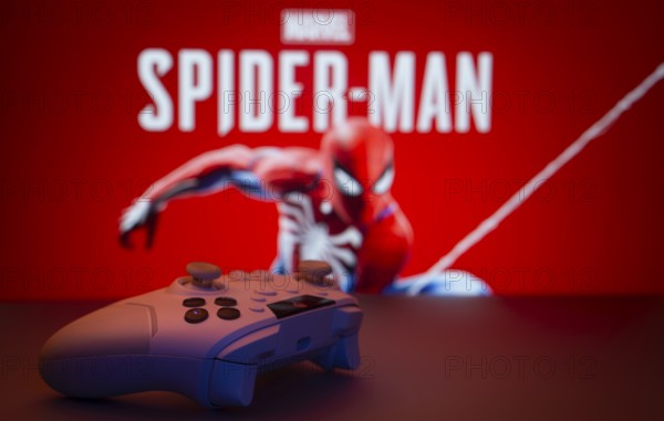 Dhaka, Bangladesh- 13 Sep 2025: Game controller in front of Marvel's Spider Man on a background