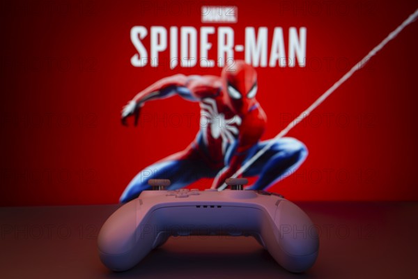 Dhaka, Bangladesh- 13 Sep 2025: Game controller in front of Marvel's Spider Man on a background