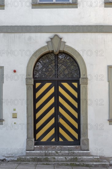 West façade with wooden gate and iron grille, New Castle in Kisslegg, Allgäu, Baden-Württemberg, Germany
