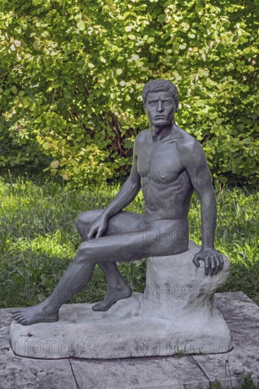 Male sculpture, bronze copy, title Wäcnter, by WLHELM RIEDISSER, in the castle park in Kisslegg, Allgäu, Baden-Württemberg, Germany