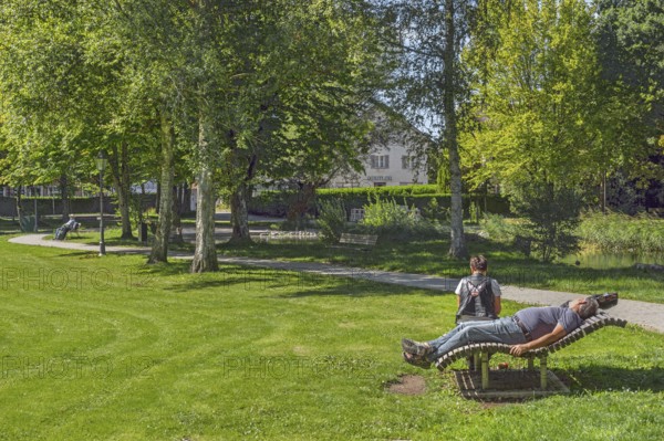 Relaxed visitors in the castle park in Kisslegg, Allgäu, Baden-Württemberg, Germany