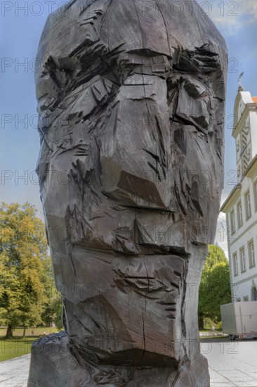 New castle with wooden sculpture by Klaus Prior in Kisslegg, Allgäu, Baden-Württemberg, Germany