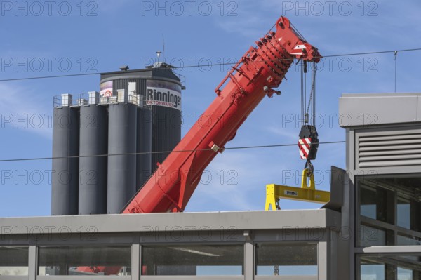Mobile crane with telescopic boom and silos for concrete products in Kisslegg, Allgäu, Baden-Württemberg, Germany