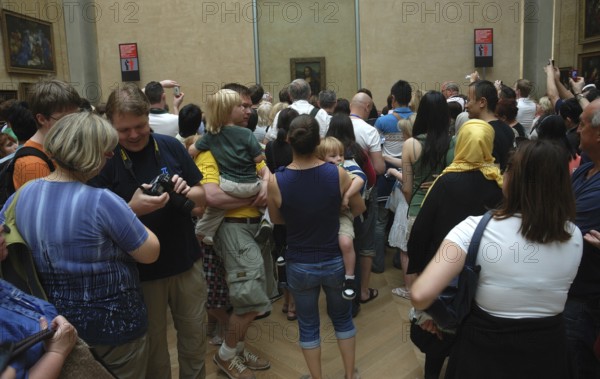 Louvre Museum, visitors in front of the Mona Lisa. redactional use only